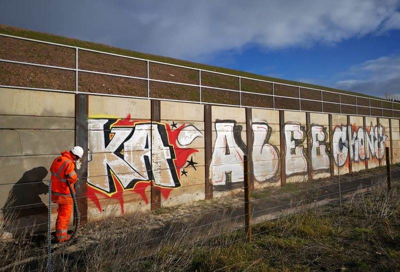 Cleaning Graffiti From A Railway Line